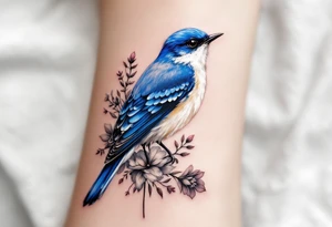 Puffy bluebird surrounded by wild flowers tattoo idea