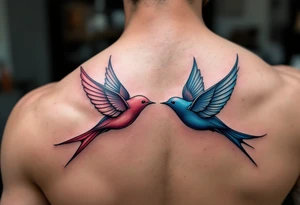 Stylized swallows in dusty rose and deep blue flying toward each other on the back shoulders signify freedom and loyalty. tattoo idea