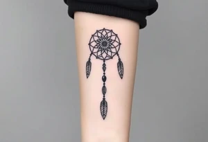 native dreamcatcher with flowing feathers and sacred beads tattoo idea