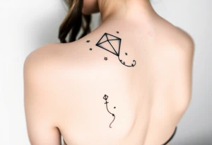 hand letting go kite tattoo idea