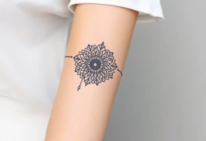 A delicate lace armband in a mandala style, incorporating intricate, circular details tattoo idea