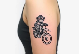 cheeky monkey on a dirt bike wearing goggles tattoo idea