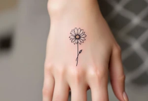 A band with a single engraved daisy tattoo idea