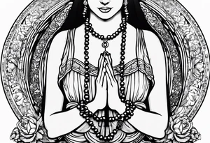 A woman’s praying hands holding a rosary catholic style tattoo idea