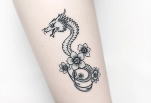 Leg area back of calf dragon going up 4 flowers
 Dragon flipped closer to the third one down realistic femine tattoo idea