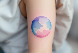 A watercolor-style circle blending soft blue, lavender, and pink hues to represent emotional harmony. tattoo idea
