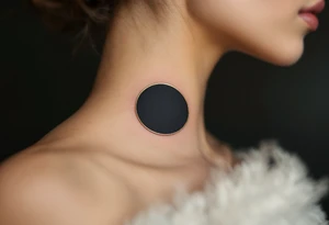 A solid black circle with a thin gold outline, evoking elegance and strength. tattoo idea