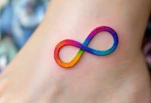 A rainbow-colored infinity symbol reflects the limitless nature of freedom. tattoo idea