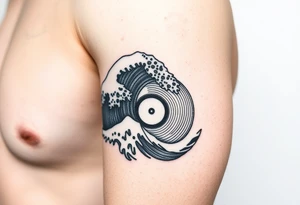 waves crashing into a vinyl record tattoo idea