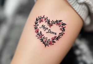 A delicate black and pink line-art heart with the word “Moje Dcera” written in elegant cursive across the center. tattoo idea