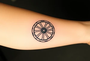 Wagon wheel with busted spokes tattoo idea
