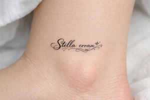 Delicate calligraphy of Stella erran on the inner ankle tattoo idea