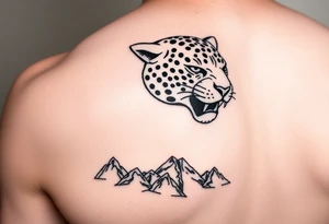 Jaguar face in the back of the arm close to elbow mountains at the bottom close to the wrist tattoo idea