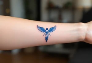 A sapphire-blue winged Isis, arms outstretched in divine motherhood. tattoo idea