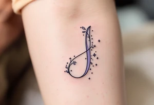 Whimsical curly "J" in lavender with tiny stars dotting the tail. tattoo idea