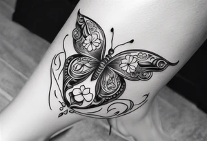 Butterfly wrap tattoos in heart with large centre piece with moon and floral theme. Bracelet around ankle show on higher ankle tattoo idea