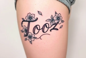 Tooz in cursive surrounded by hibiscus flowers tattoo idea