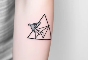 Small geometric triangle with a geometric paper plane going around the world with thin fine lines tattoo idea