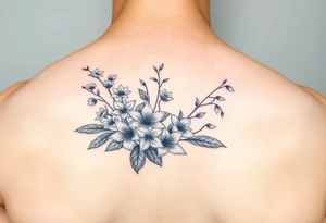 Larkspur and lily of the valley bouquet tattoo idea