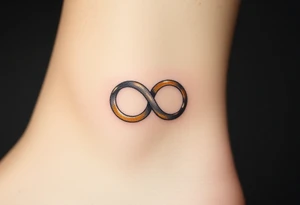 A delicate infinity symbol made of interlocking wedding rings, with soft metallic gold and silver tones tattoo idea