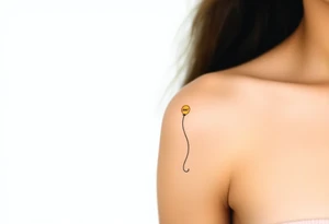 small yellow balloon with letters osaat on bicep tattoo idea