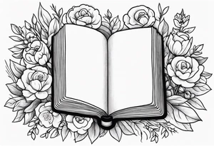 Bible surrounded by flowers tattoo idea