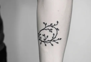 simple clean vines wrap around with small branch off tattoo idea