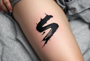 A black ink brushstroke "S" inspired by Japanese calligraphy. tattoo idea