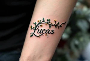 Luky name 15. 02. 2021 – Deep emerald green vine twisting around Lucas's birthdate, with small yellow blooms dotting the numbers. tattoo idea