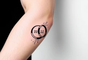 two wedding rings as symbol of infinity with date 22. 7. 2018 tattoo idea