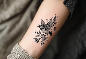 Bird with flowers tattoo idea