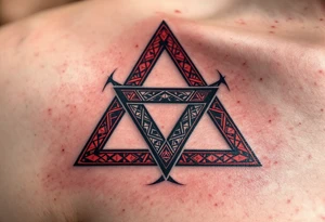 A bold triquetra, filled with deep red and black patterns tattoo idea