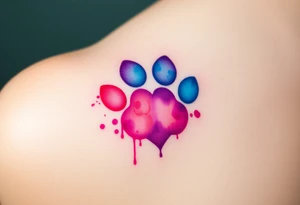 A watercolor-style paw print in the shape of a heart, blending vibrant hues of pink, blue, and purple, creating a soft and artistic splash effect tattoo idea