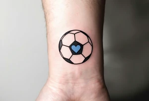 A minimalist black outline of a soccer ball with a single blue heart at its center. tattoo idea