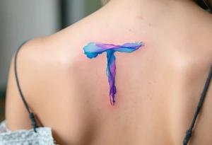 A watercolor-style "T" in shades of turquoise and purple, blending like paint strokes. tattoo idea