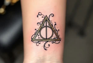 A detailed Deathly Hallows symbol (triangle, circle, and line) surrounded by swirling gold and silver tattoo idea