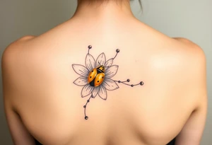 Golden or yellow ladybug on a whispy flower tattoo idea