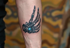 A mechanical part of forearm revealing graphite-colored artificial tendons under realistic shaded skin, accented with electric-blue joints. tattoo idea