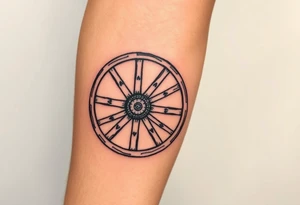 Old wagon wheel with some busted spokes aged and weathered tattoo idea