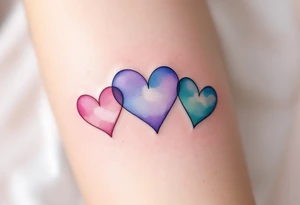 Three delicate hearts in a watercolor gradient of pink, lavender, and teal, fading into each other to symbolize everlasting love. tattoo idea