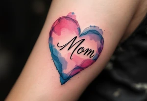 A watercolor heart in pink and blue with the word “Mom” scripted across it in elegant cursive. tattoo idea