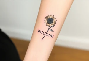 Word "PHUONG" written vertical with the sunflower. tattoo idea