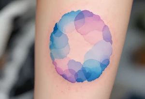 A watercolor-style circle blending soft blue, lavender, and pink hues to represent emotional harmony. tattoo idea