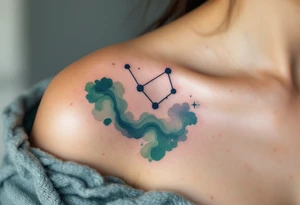 A dark blue Virgo constellation floats above the zodiac symbol carved in moss green near the collarbone. tattoo idea