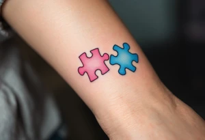 Interlocking puzzle pieces in soft pink and muted blue on the inner wrists symbolize how perfectly you fit together. tattoo idea