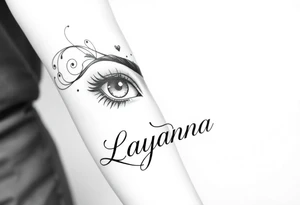 Girl eyes with the name layanna at the bottom of it tattoo idea
