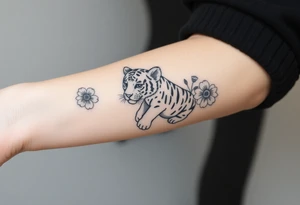 Floral tattoo with baby tiger in the flowers 🌺 tattoo idea