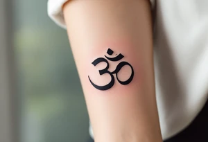 The Om Symbol (ॐ) – A sacred sound and spiritual icon, often tattooed in black or deep gold, representing the essence of the universe. tattoo idea
