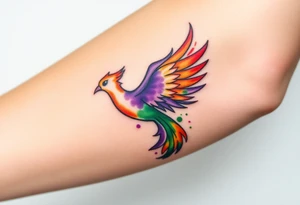 Phoenix with blazing flames with purple and green splashes with ash falling from its tail tattoo idea