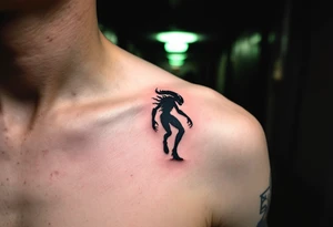 A silhouette of a Xenomorph stalking through a dark hallway, its outline softly illuminated by an eerie green light from above. tattoo idea